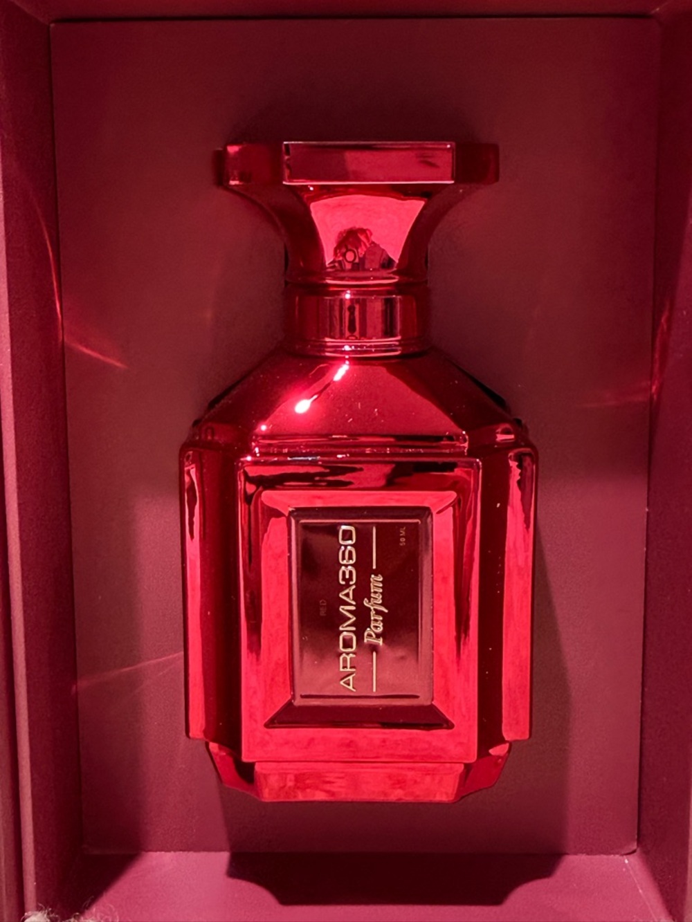 Aroma360 Red luxury Parfum in red bottle.
